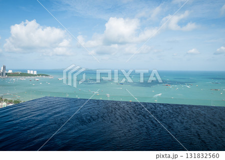 Scenic infinity pool overlooking blue ocean pattaya thailand travel serene atmosphere Scenic infinity pool overlooking blue ocean pattaya thailand travel serene atmosphere 131832560