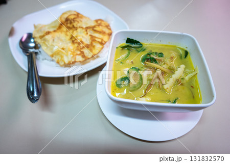Delicious chicken curry and roti local restaurant food cozy eatery close-up culinary delight Delicious chicken curry and roti local restaurant food cozy eatery close-up culinary delight 131832570