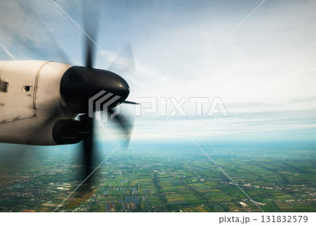 Aerial view of propeller aircraft over scenic landscape travel adventure nature exploration 131832579