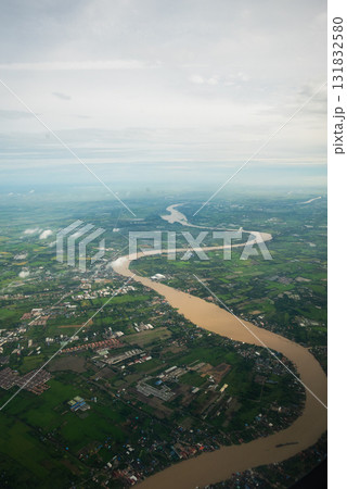Aerial view of meandering river in lush green landscape nature scenic environment Aerial view of meandering river in lush green landscape nature scenic environment 131832580