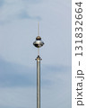 Innovative communication tower urban setting cloudy sky close-up perspective 131832664
