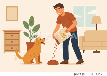 Young man feeding dog at home Young man feeding dog at home 131834570