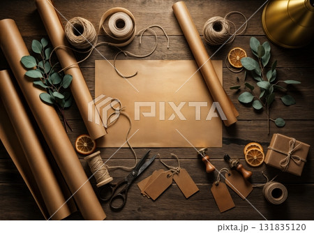 Artisan Christmas Gift Wrapping Workshop Station with Kraft Paper Rolls Natural Twine Vintage Scissors and Eucalyptus Sprigs on Reclaimed Barn Wood Surface Artisan Christmas Gift Wrapping Workshop Station with Kraft Paper Rolls Natural Twine Vintage Scissors and Eucalyptus Sprigs on Reclaimed Barn Wood Surface 131835120