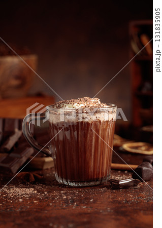 Hot chocolate topped with whipped cream and sprinkled with chocolate chips. Hot chocolate topped with whipped cream and sprinkled with chocolate chips. 131835905