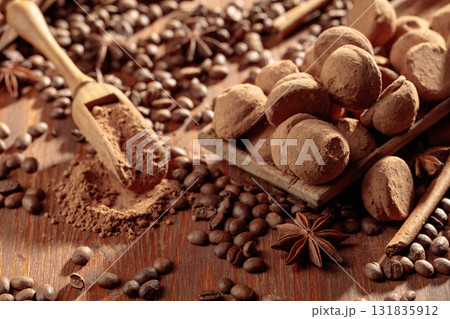 Chocolate truffles and cacao powder. Chocolate truffles and cacao powder. 131835912