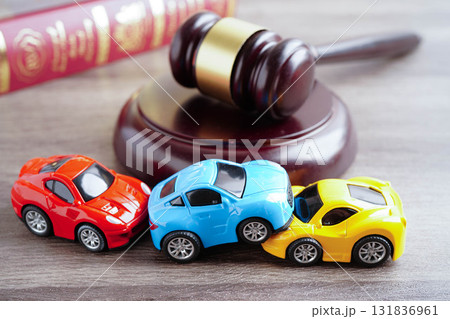 Bangkok, Thailand March 15, 2023 Car accident lawsuit and insurance, Judge hammer with car model. Bangkok, Thailand March 15, 2023 Car accident lawsuit and insurance, Judge hammer with car model. 131836961