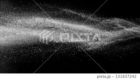 Black and white dust stream in the air. Fine particles suspended in motion on black background. Abstract slow motion texture for concepts of air, dust, purity, or science visuals. Black and white dust stream in the air. Fine particles suspended in motion on black background. Abstract slow motion texture for concepts of air, dust, purity, or science visuals. 131837242