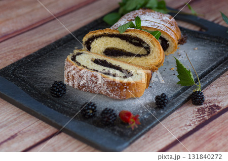 Homemade bun with poppy seed filling close-up 131840272