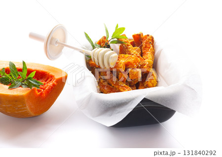 Rustic baked pumpkin with caramelized honey and sesame topping Rustic baked pumpkin with caramelized honey and sesame topping 131840292