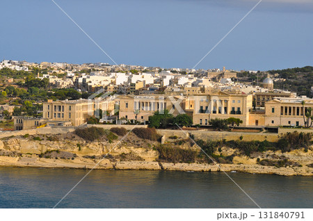 The historic Bighi Complex in Kalkara, Malta, featuring imposing architecture and coastal views along Triq Marina. Cultural heritage of Malta The historic Bighi Complex in Kalkara, Malta, featuring imposing architecture and coastal views along Triq Marina. Cultural heritage of Malta 131840791