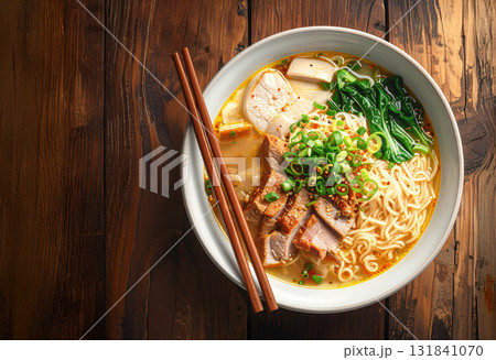 Ramen noodle soup with pork, egg, and green onion topping 131841070