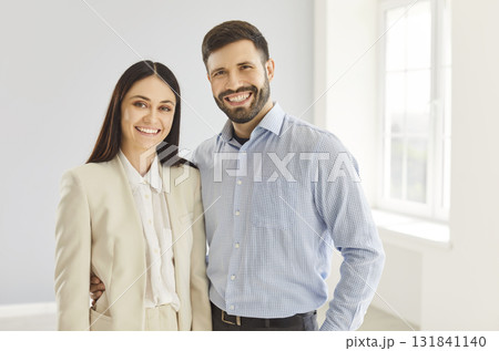 Happy Married Couple Smiling Together In Their New Home 131841140