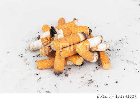 Pile of Cigarette Butts on White Background Pile of Cigarette Butts on White Background 131842327