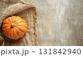 Halloween and thanksgiving pumpkins with rustic fabric. Craft, cozy minimalist background. 131842940
