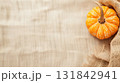 Minimal rustic fall background with pumpkins and fabric for Halloween, thanksgiving, fall designs. 131842941