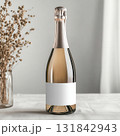 Mockup of champagne bottle with blank label on natural boho textured background. 131842943