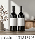 Wine branding mockup with two red bottles and blank labels. Realistic minimalist presentation scene. 131842946