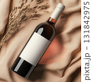 Minimalist wine bottle mockup with blank label on soft beige surface. 131842975