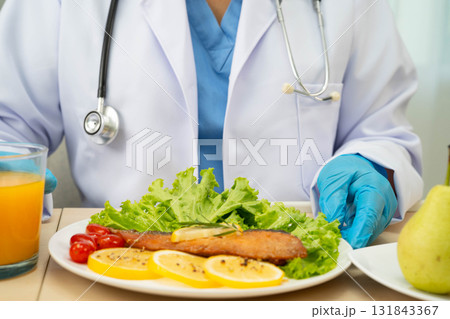 Asian Nutritionist holding healthy food for patient in hospital, nutrition and vitamin. 131843367