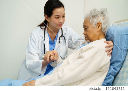 Asian doctor checking and treat elderly woman patient health in hospital. Asian doctor checking and treat elderly woman patient health in hospital. 131843811