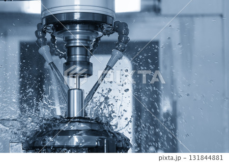 The CNC milling machine cutting the shell mold parts with oil coolant method . 131844881