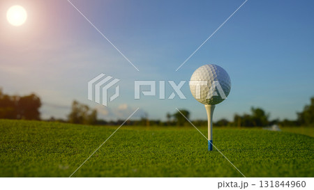 Close-up golf ball on tee with blur green bokeh background. 131844960
