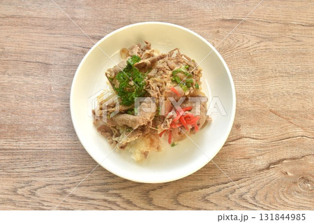 pork yakiniku or barbecue meat topping rice with slice red pickled ginger on plate 131844985