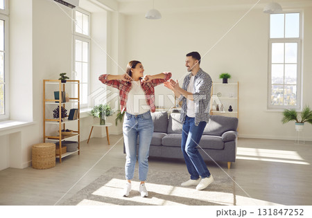 Joyful Family Dancing in the Living Room 131847252