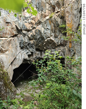 Mysterious Cave Entrance Amidst Rocky Terrain A Geological Wonder and Natural Hideaway Mysterious Cave Entrance Amidst Rocky Terrain A Geological Wonder and Natural Hideaway 131847788