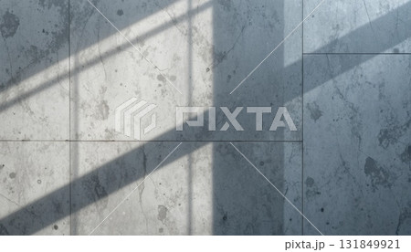 Sunlight Casting Shadows on a Textured Grey Floor During Daylight Hours in a Minimalist Space 131849921