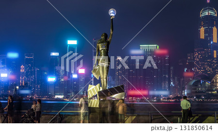 Bronze statue of Hong Kong Film Awards and skyline in Avenue of Stars timelapse hyperlapse. Bronze statue of Hong Kong Film Awards and skyline in Avenue of Stars timelapse hyperlapse. 131850614