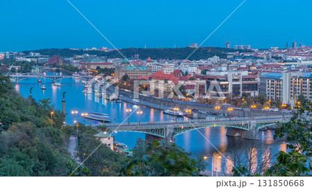 Aerial evening view of the Vltava River and illuminated bridges day to night timelapse, Prague 131850668