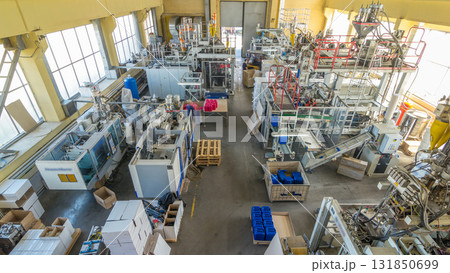 A factory for plastic canister production timelapse hyperlapse. The conveyor in the factory. 131850699