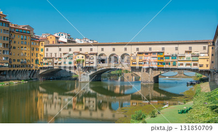 The Ponte Vecchio on a sunny day timelapse, a medieval stone segmental arch bridge over the Arno River in Florence, Italy 131850709