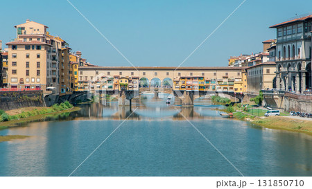 The Ponte Vecchio on a sunny day timelapse, a medieval stone segmental arch bridge over the Arno River in Florence, Italy 131850710
