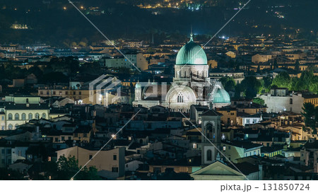Synagogue of Florence night timelapse with green copper dome rising above surrounding suburban housing 131850724