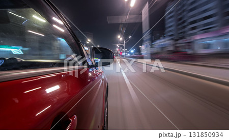 Drivelapse urban look from fast driving car at a night avenue in a city timelapse hyperlapse Drivelapse urban look from fast driving car at a night avenue in a city timelapse hyperlapse 131850934