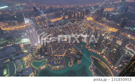Dubai downtown day to night transition with city lights from above timelapse Dubai downtown day to night transition with city lights from above timelapse 131850953