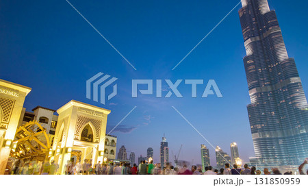 Bridge and fountains with Burj Khalifa day to night transition, Dubai, Emirates timelapse 131850959