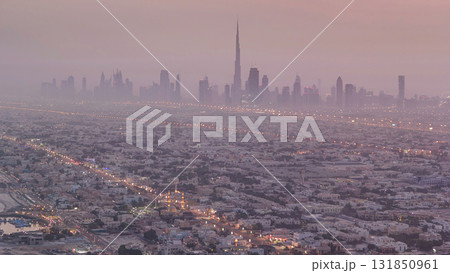 Skyline view of Dubai from night to day transition, UAE. Timelapse 131850961