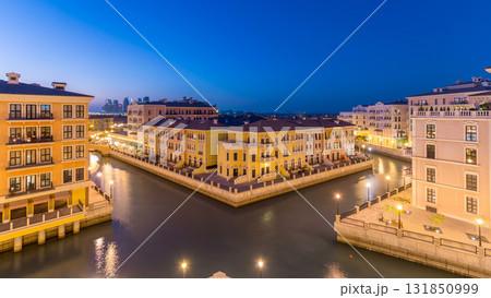 Canal aerial top view in Venice-like Qanat Quartier of the Pearl precinct of Doha day to night timelapse, Qatar. Canal aerial top view in Venice-like Qanat Quartier of the Pearl precinct of Doha day to night timelapse, Qatar. 131850999