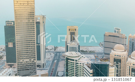 Skyscrapers before sunset timelapse in the skyline of commercial center of Doha, the capital Qatar Skyscrapers before sunset timelapse in the skyline of commercial center of Doha, the capital Qatar 131851067