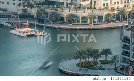 Luxury Dubai Marina canal with passing boats and promenade timelapse, Dubai, United Arab Emirates Luxury Dubai Marina canal with passing boats and promenade timelapse, Dubai, United Arab Emirates 131851180