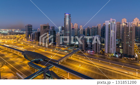 Dubai Marina skyscrapers aerial top view before sunrise from JLT in Dubai night to day timelapse, UAE. Dubai Marina skyscrapers aerial top view before sunrise from JLT in Dubai night to day timelapse, UAE. 131851200