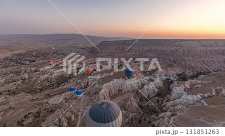 Aerial view from hot air balloon during Sunrise over the fairytale landscape hills of Kapadokya timelapse hyperlapse with morning light. 131851263