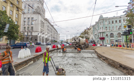 Concrete works for road maintenance construction with many workers and mixer machine timelapse Concrete works for road maintenance construction with many workers and mixer machine timelapse 131851315