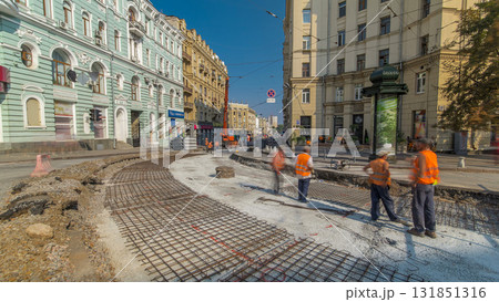 Workers do cutting reinforcement for tram tracks in the city timelapse Workers do cutting reinforcement for tram tracks in the city timelapse 131851316