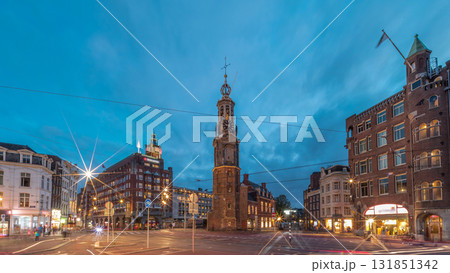 Munttoren tower and flowers market. Panoramic day to night timelapse hyperlapse of Amsterdam city center. Netherlands Munttoren tower and flowers market. Panoramic day to night timelapse hyperlapse of Amsterdam city center. Netherlands 131851342