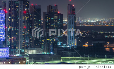 Aerial skyline of Abu Dhabi city centre from above night timelapse Aerial skyline of Abu Dhabi city centre from above night timelapse 131851543