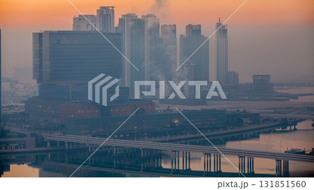 Abu Dhabi city skyline with skyscrapers before sunrise from above night to day timelapse 131851560